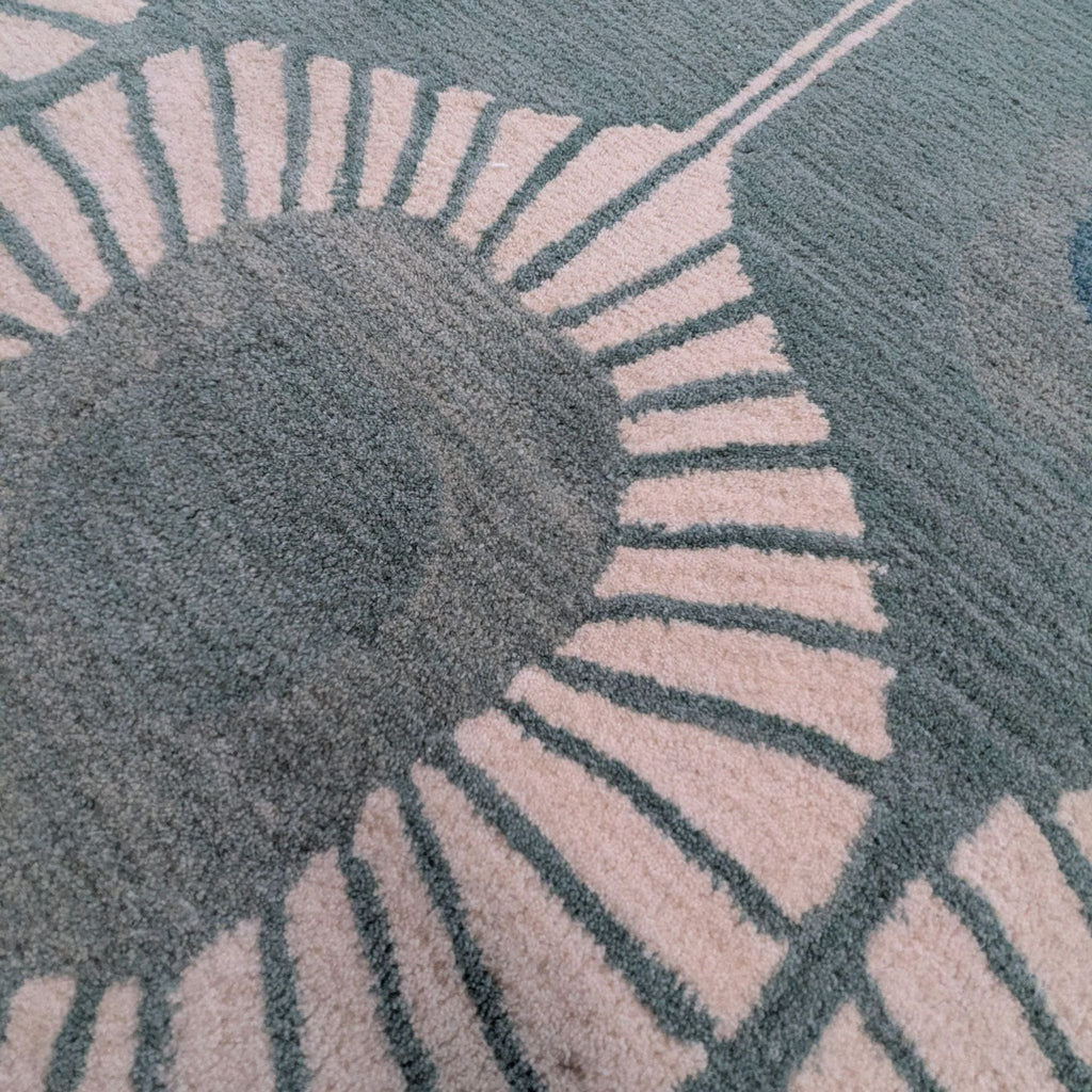 Geometric-patterned Bashian rug in blue and cream, offering durable comfort and style for any room.