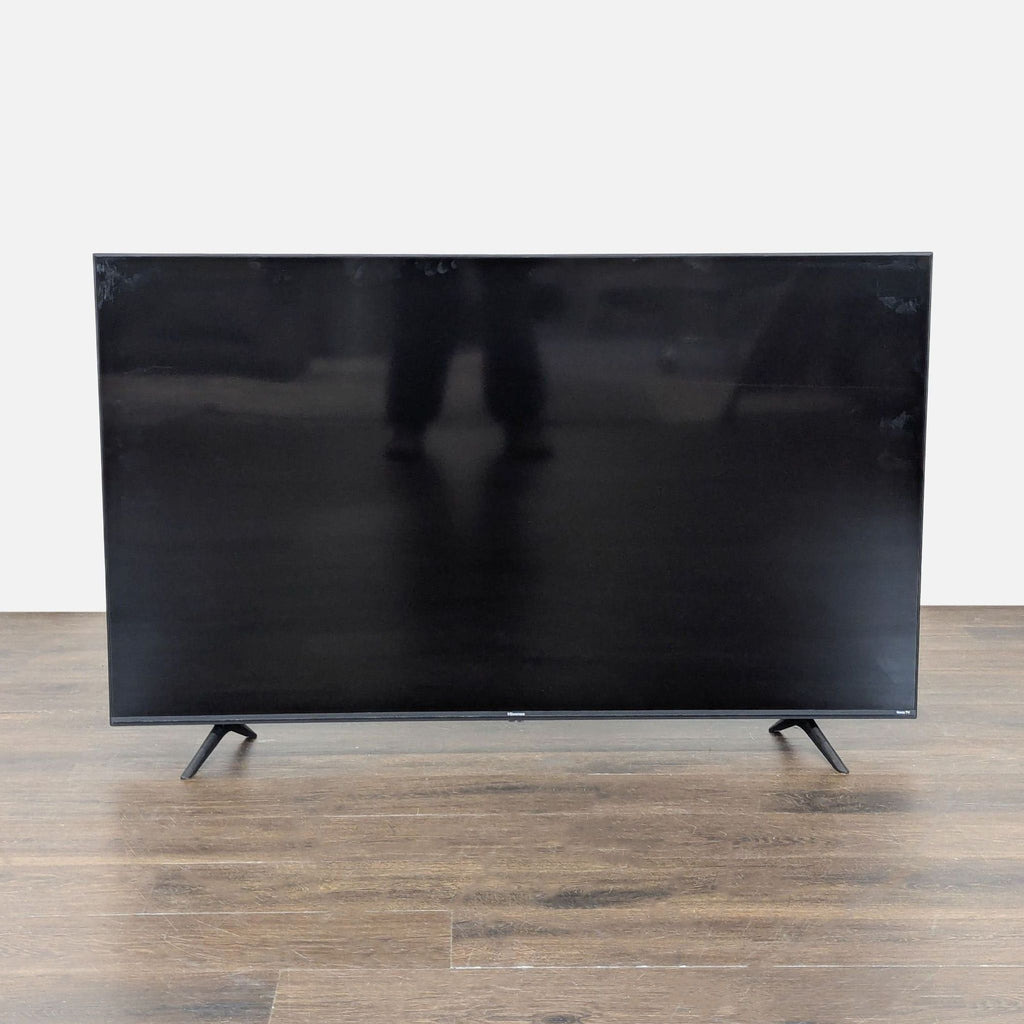 Hisense 50" TV showing streaming apps, featuring a sleek design and multiple HDMI ports, ready to use.