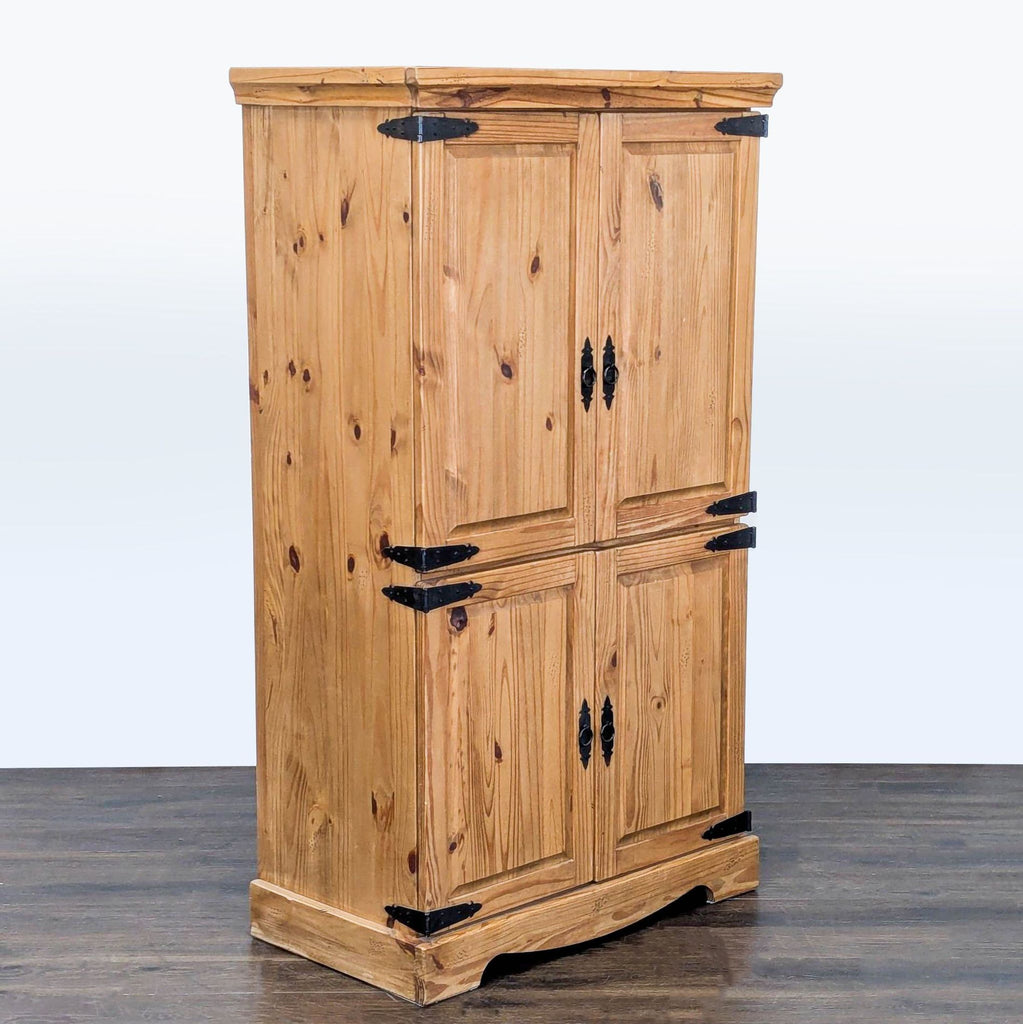 2. Closed Pier 1 Imports hutch armoire in natural wood, featuring black metal hardware and four paneled doors.