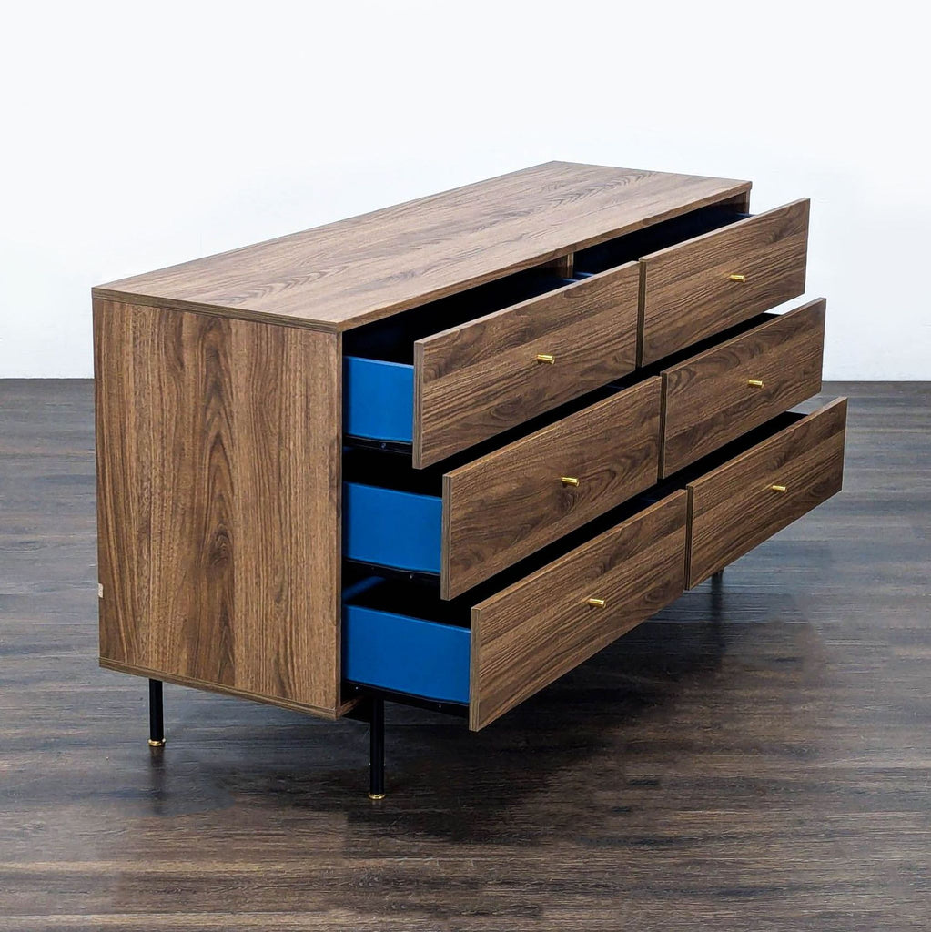 Sleek walnut Ikea dresser with six drawers on black and gold legs, ideal for bedrooms or living spaces.
