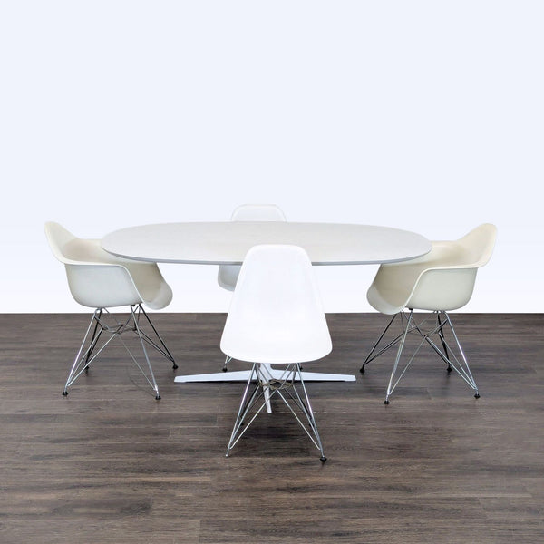 Eames Dining Set with white oval table and four matching modern chairs, ideal for kitchens or dining rooms.