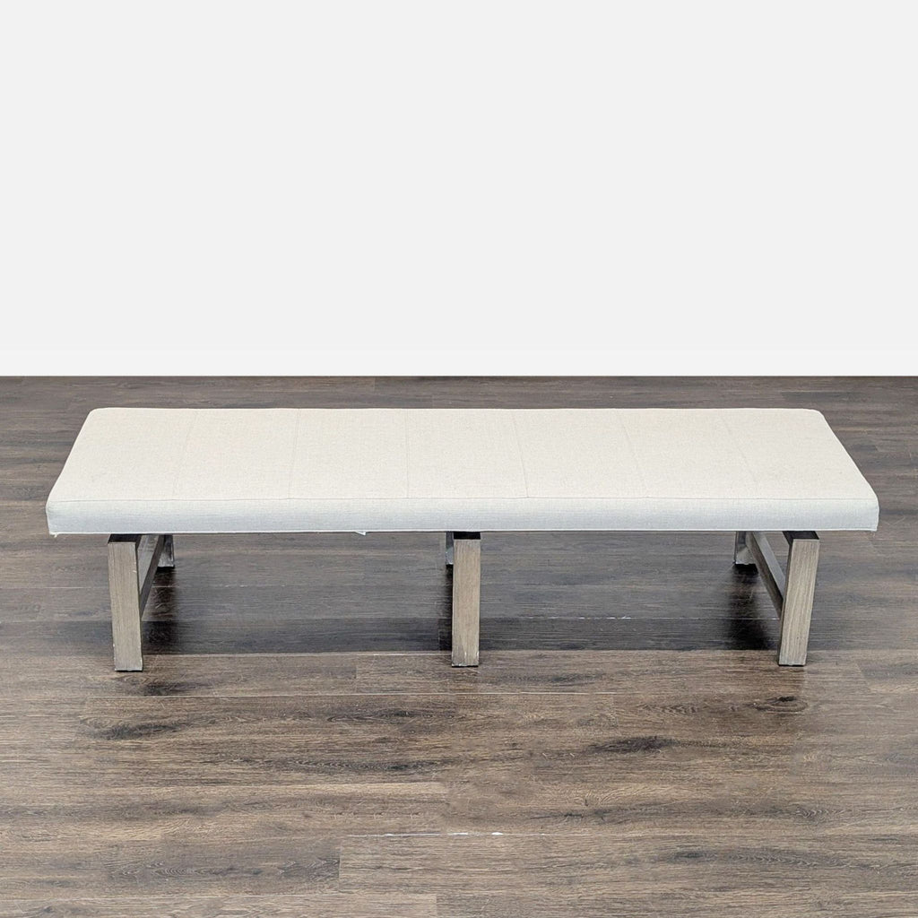 2. Modern wood bench with cushioned seat from Vanguard Furniture, ideal for seating in various spaces.  