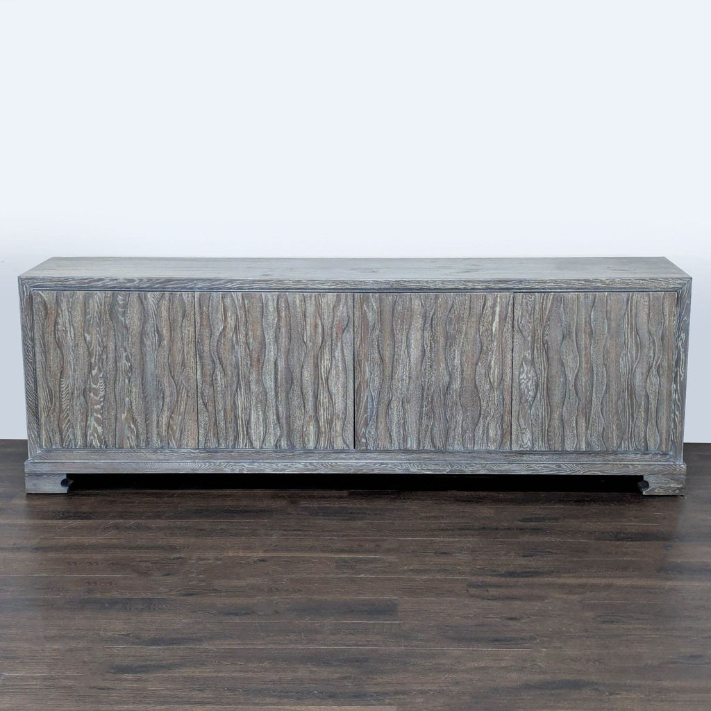 Gray washed entertainment center by Vanguard Furniture with sculpted cabinet doors and modern design.
