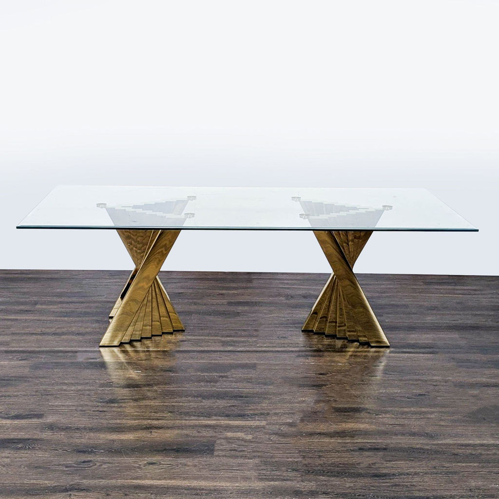 1. Modern dining table with beveled glass top and spiral bar double pedestal base in brass finish by Willa Arlo Interiors.  