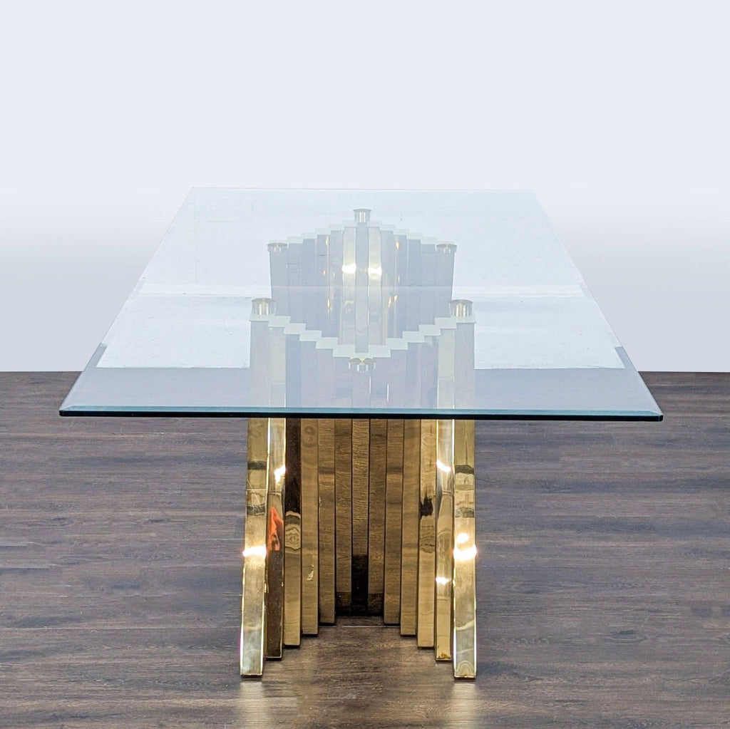 3. Contemporary Willa Arlo Interiors dining table with a brass spiral bar base and beveled glass top, front view.