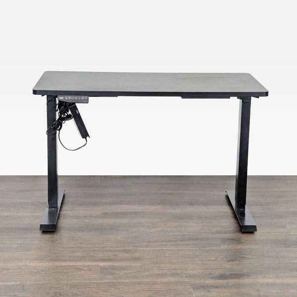 Flexispot electric desk with black tabletop, sturdy metal legs, and height-adjustment control panel for versatile use.  