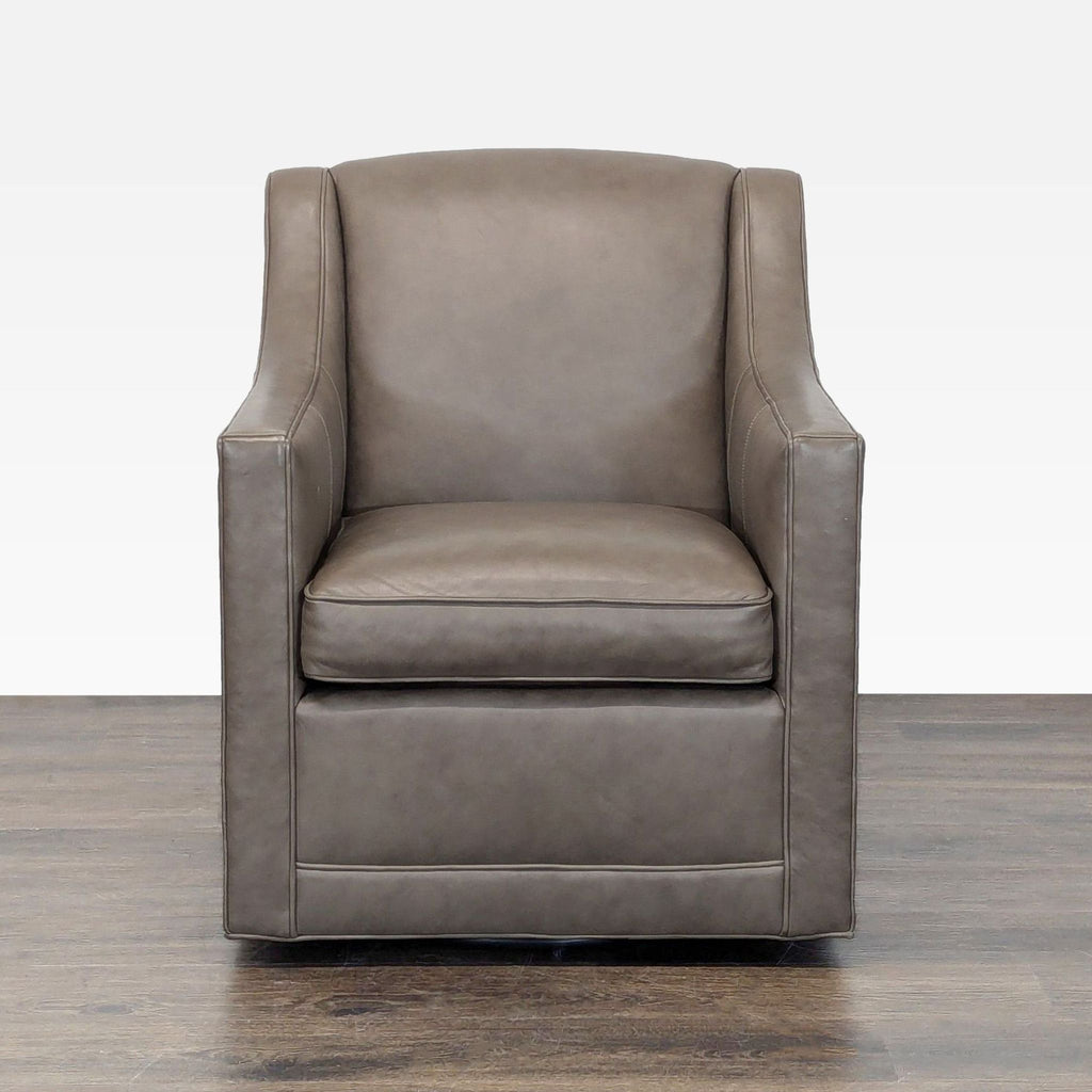 Modern taupe leather lounge chair by Lexington with swivel base and cushioned seat, ideal for relaxation.