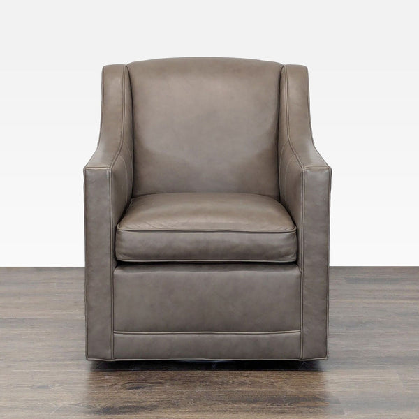 Modern taupe leather lounge chair by Lexington with swivel base and cushioned seat, ideal for relaxation.