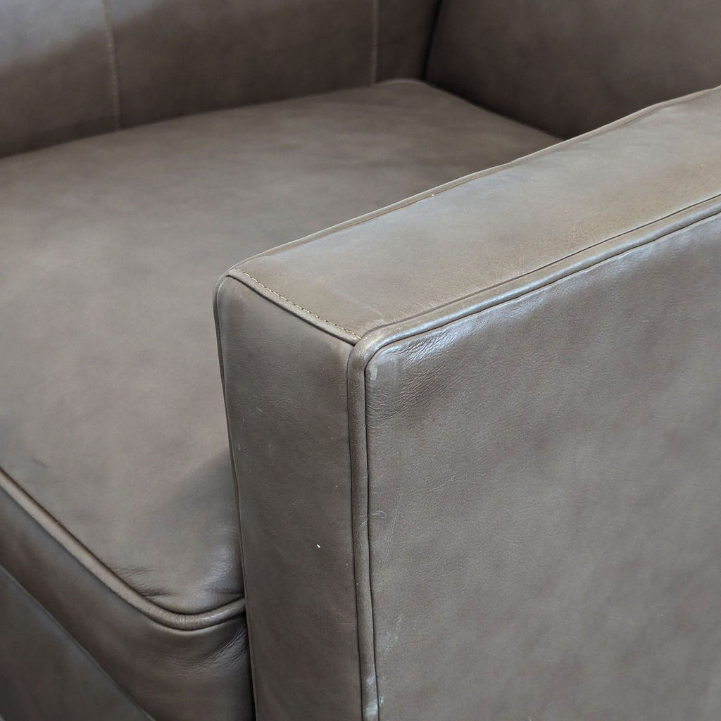 Stylish swivel lounge chair from Lexington in taupe leather, perfect for any living room or lounge area.