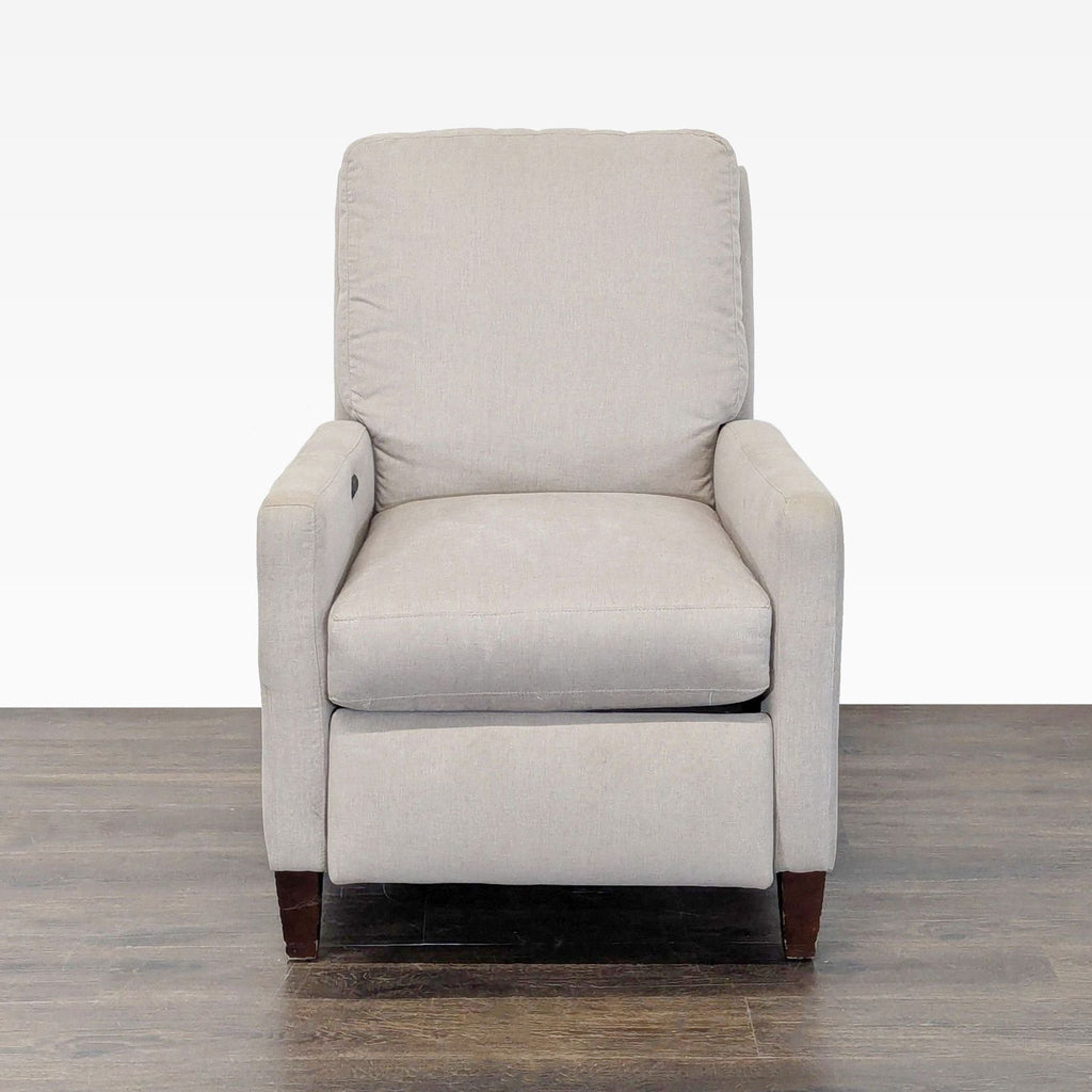 Modern power reclining lounge chair with cushioned seat and armrests, perfect for relaxing in any room.