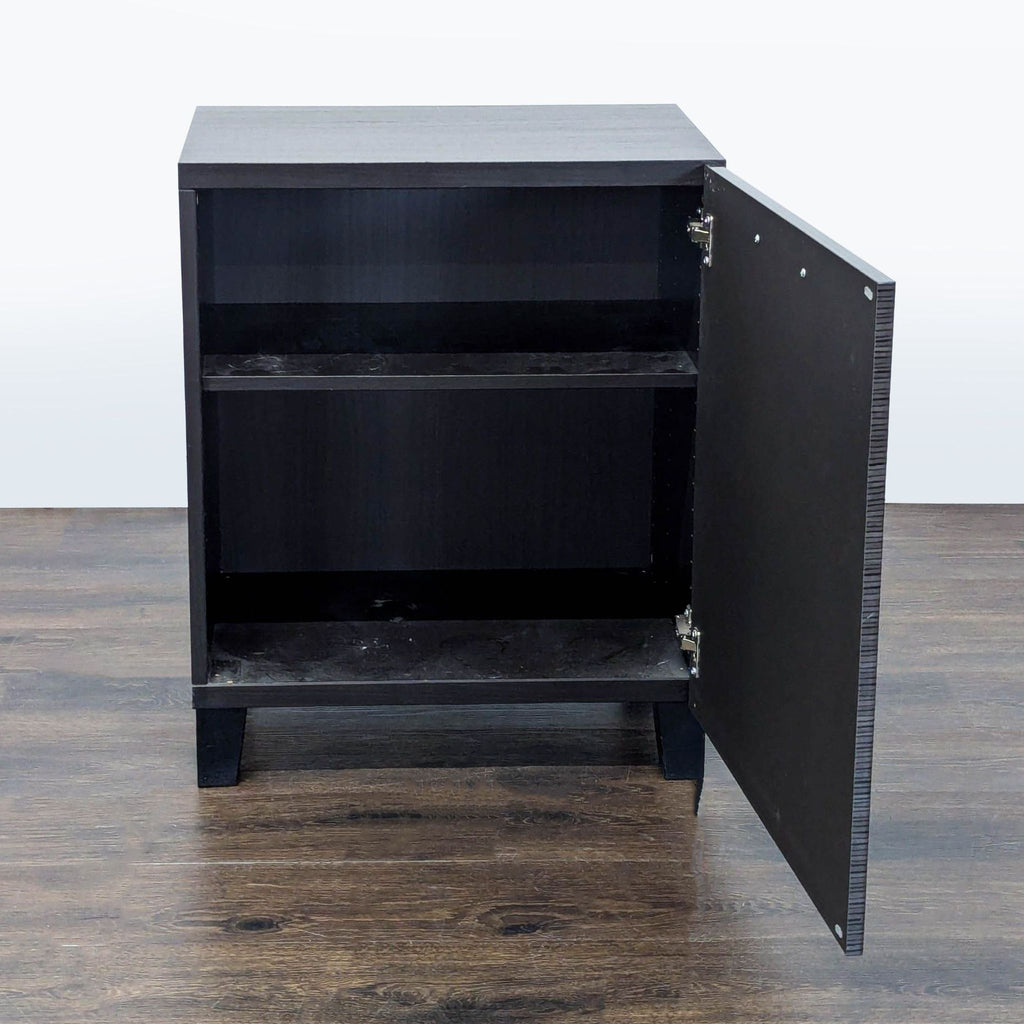 2. Cabinet with door open revealing interior shelving, dark finish and simple, modern design.