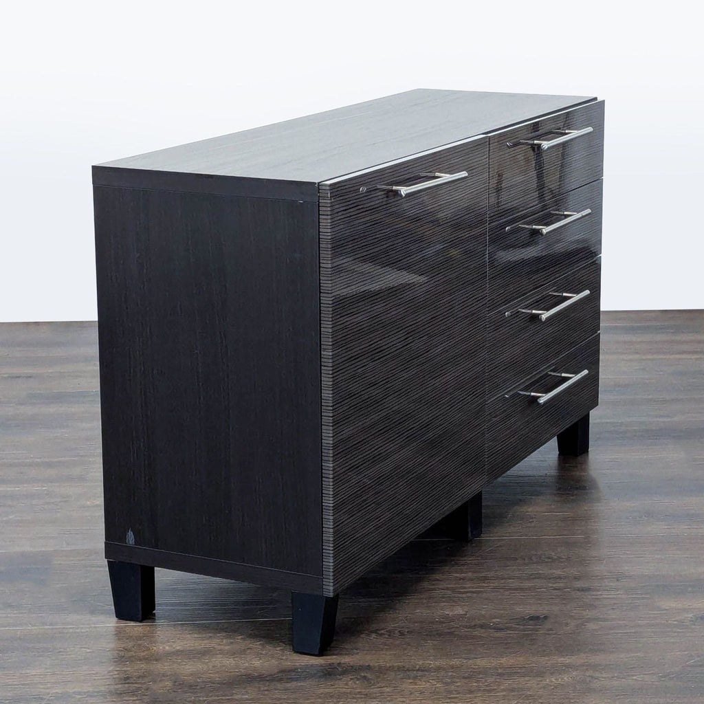 3. Angled view of Ikea sideboard with sleek handles, dark wood texture, and sturdy black legs.
