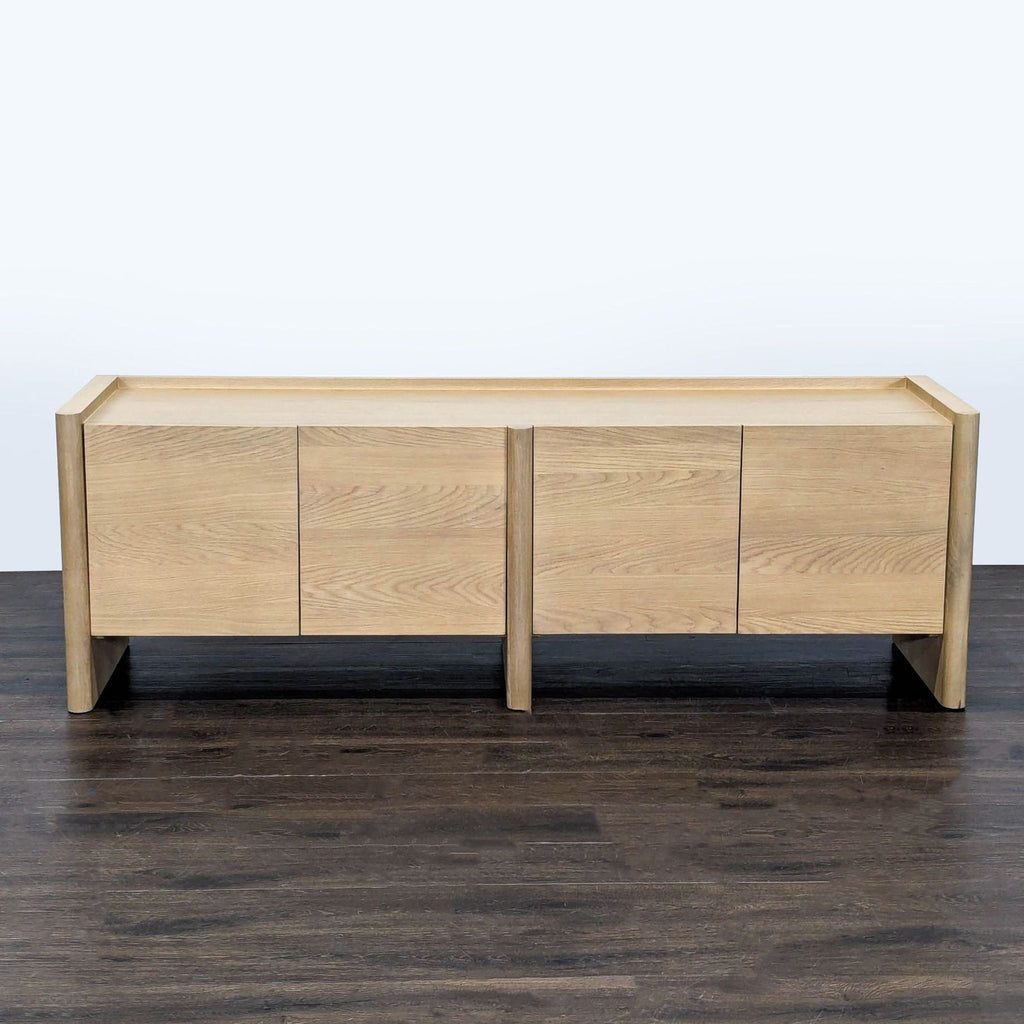 White oak entertainment center by Article with rounded legs, beveled doors, and adjustable shelves.
