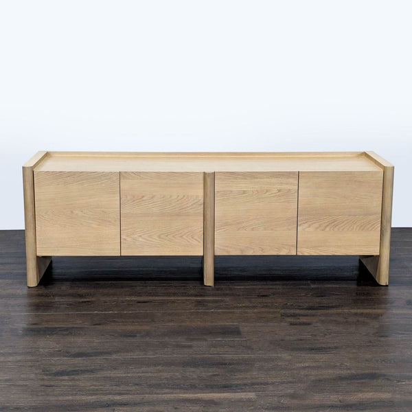 White oak entertainment center by Article with rounded legs, beveled doors, and adjustable shelves.