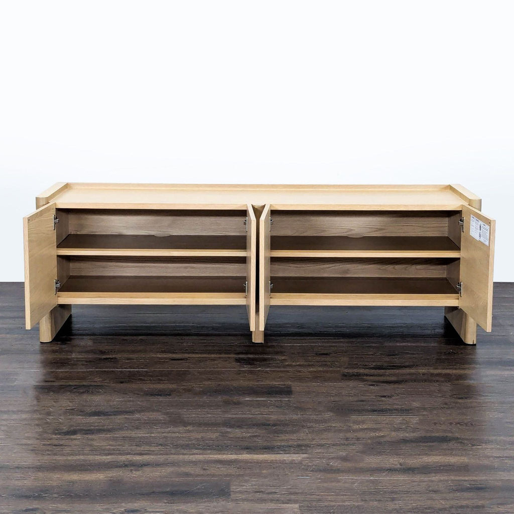Article brand white oak unit featuring beveled cupboard doors, rounded legs, and customizable interior shelves.