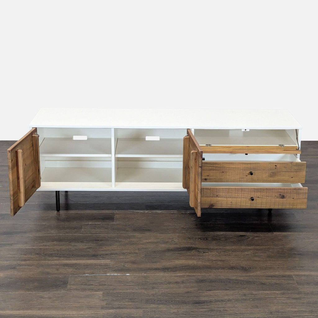 2. Open view of West Elm entertainment center showing spacious shelves and drawers for storage.  