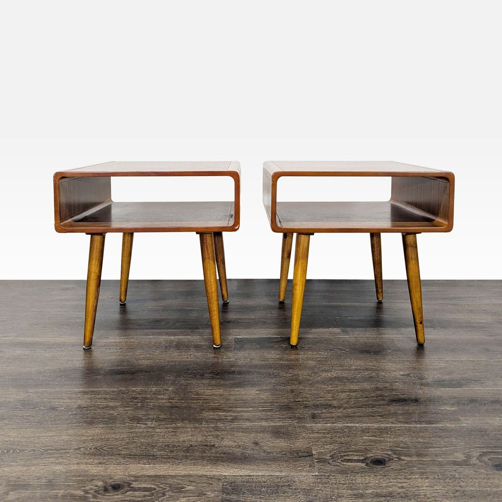 1. Pair of mid-century modern end tables with open rectangular shelf and angled wooden legs on wood floor.
