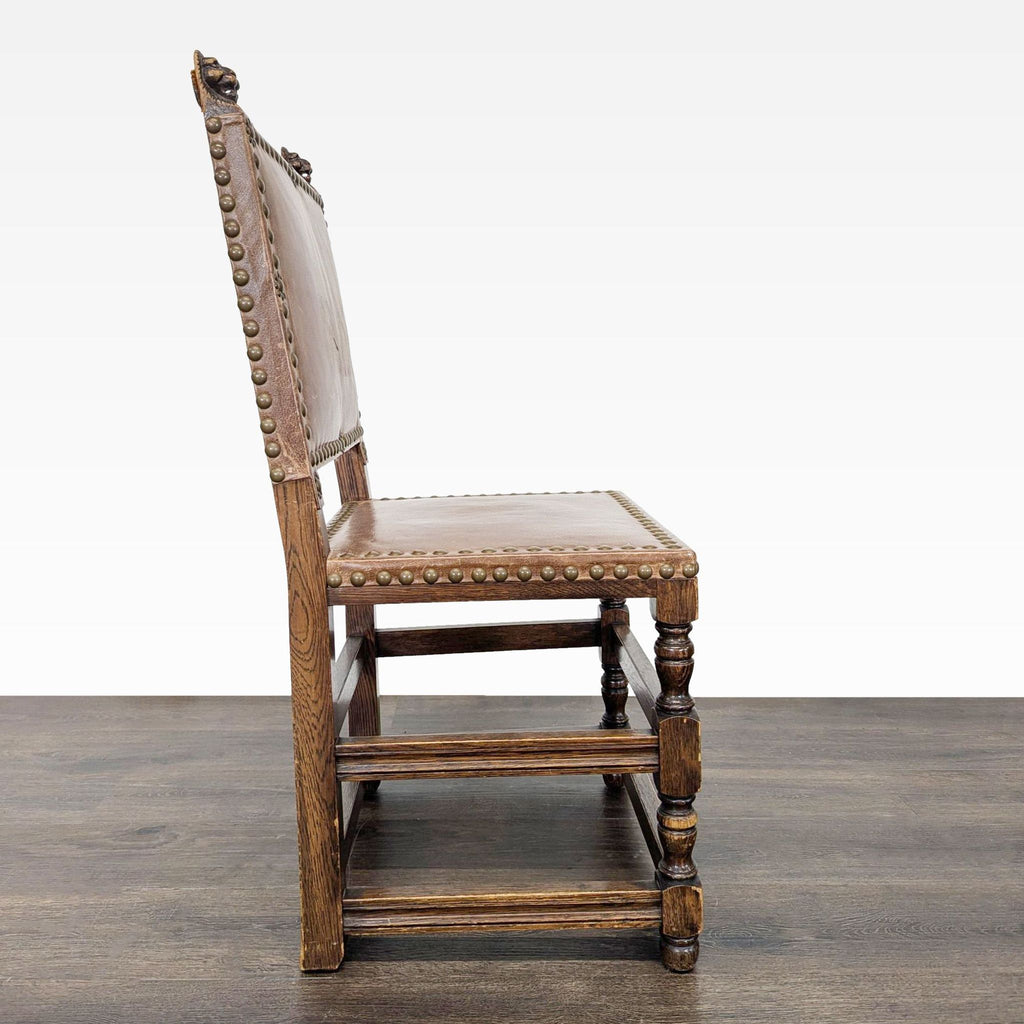 Traditional dining chair with decorated finials and nailhead details along the trim.  