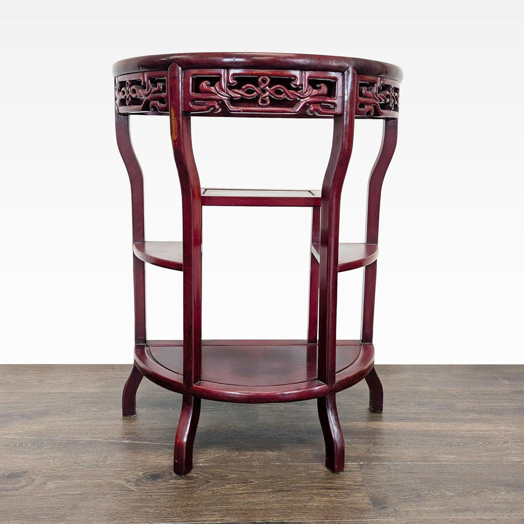 Demilune side table with carved apron and three shelves, ideal as a console accent piece.  