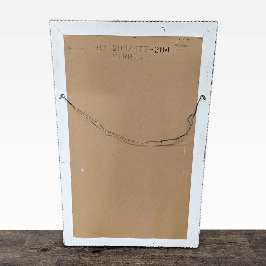 2. Back view of the mirror showing a cardboard backing and hanging wire, labeled "MIRROR".