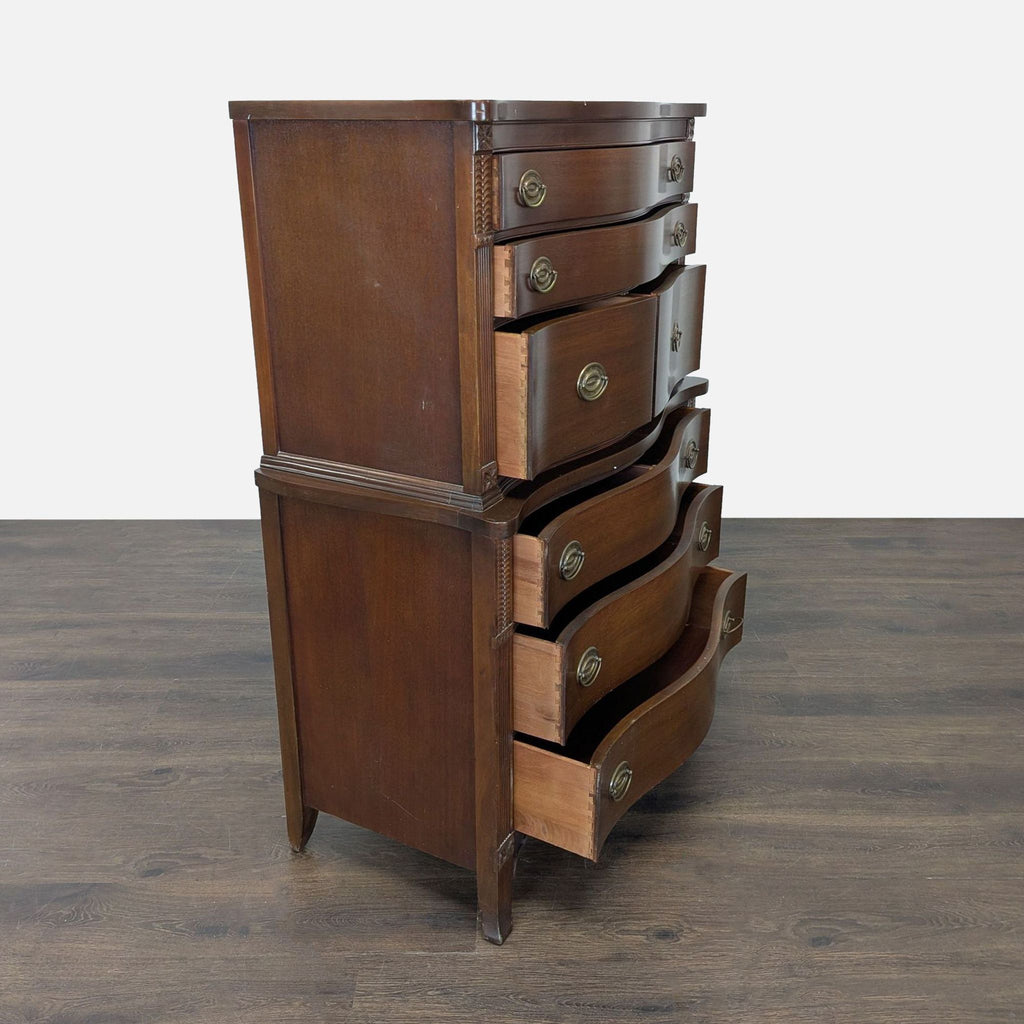 Traditional dresser with a curved front, warm wood finish, brass hardware, and spacious storage drawers.