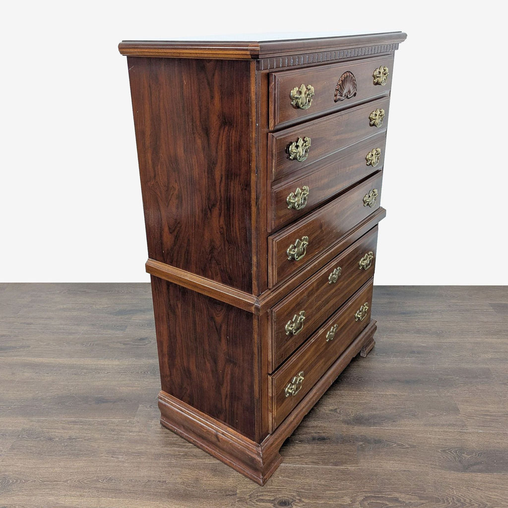 2. Angled side-front view of a classic wooden dresser featuring rich brown finish and ornate brass handles.
