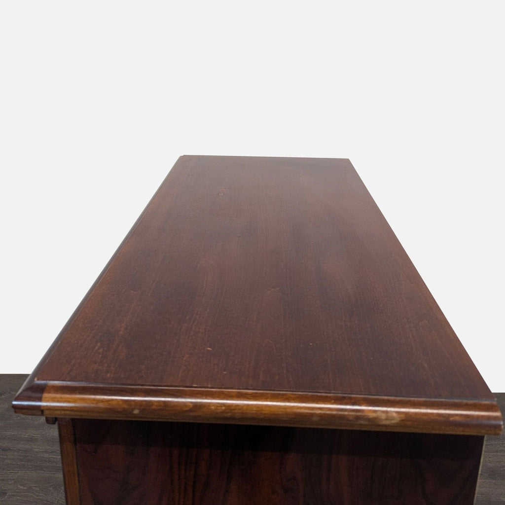 Classic Wooden Dresser with Brass Handles and Carved Details
