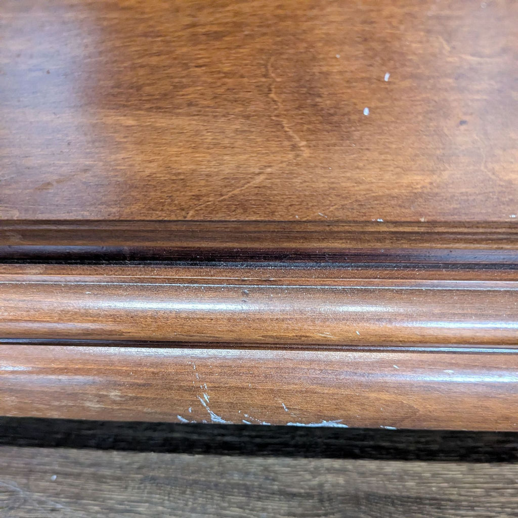 Classic Wooden Dresser with Brass Handles and Carved Details