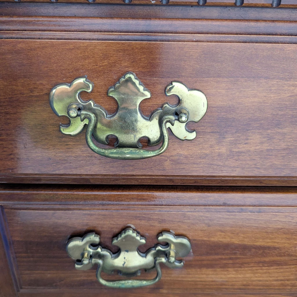 Classic Wooden Dresser with Brass Handles and Carved Details