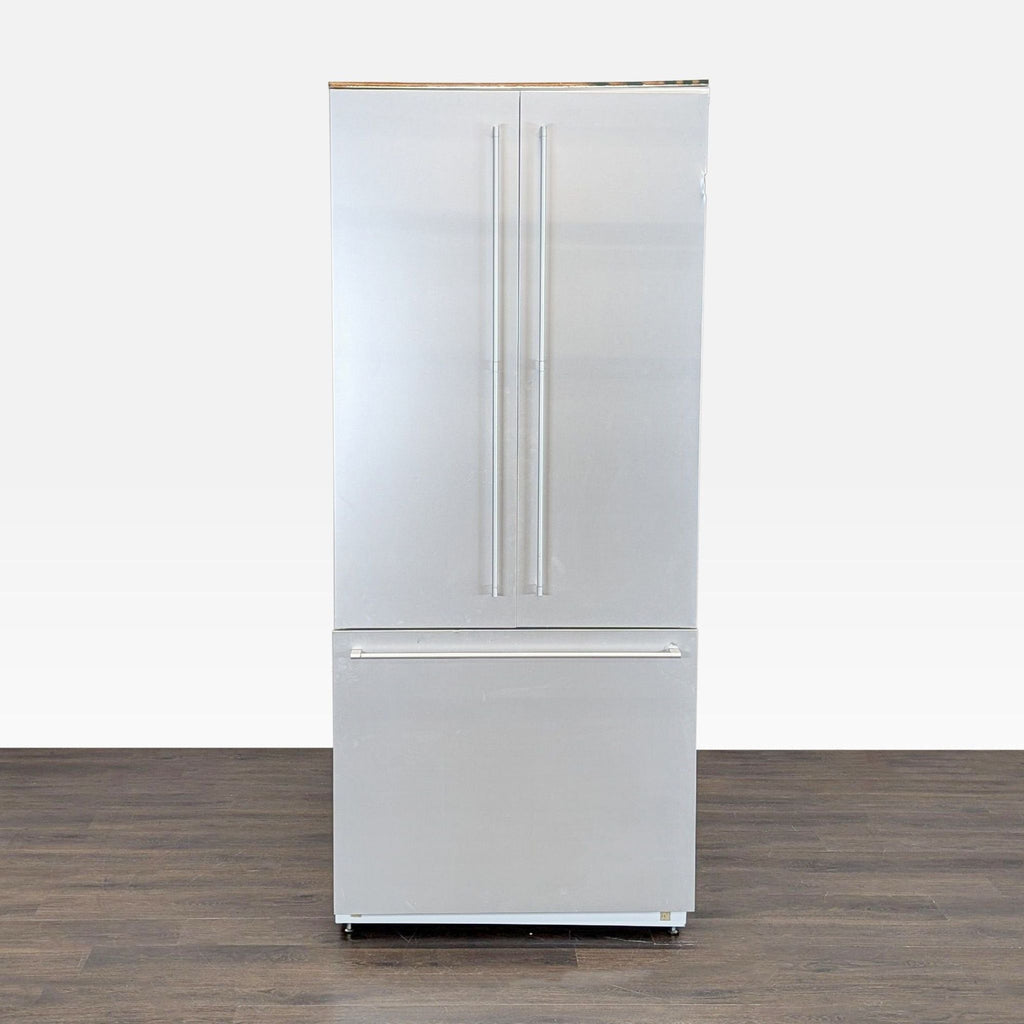 Stainless steel Gaggenau refrigerator with French doors and bottom freezer, ideal for modern kitchens.