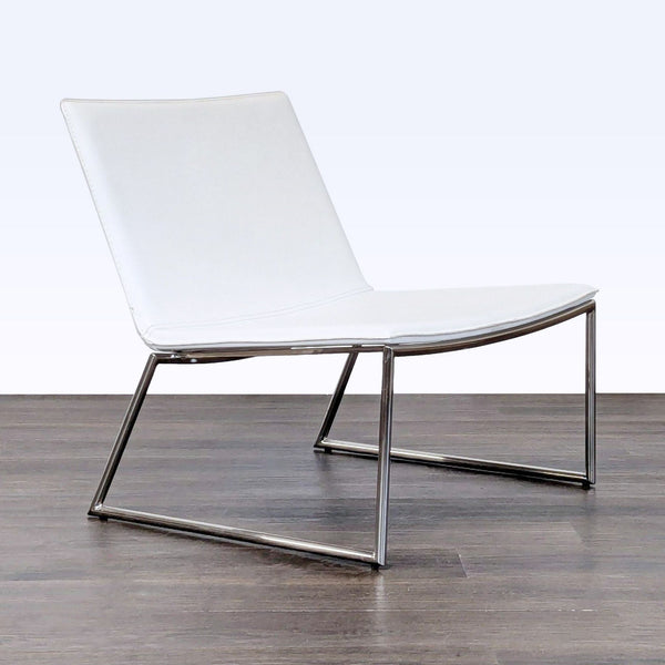 Modern white CB2 lounge chair with chrome frame, offering minimalist style for any living area.