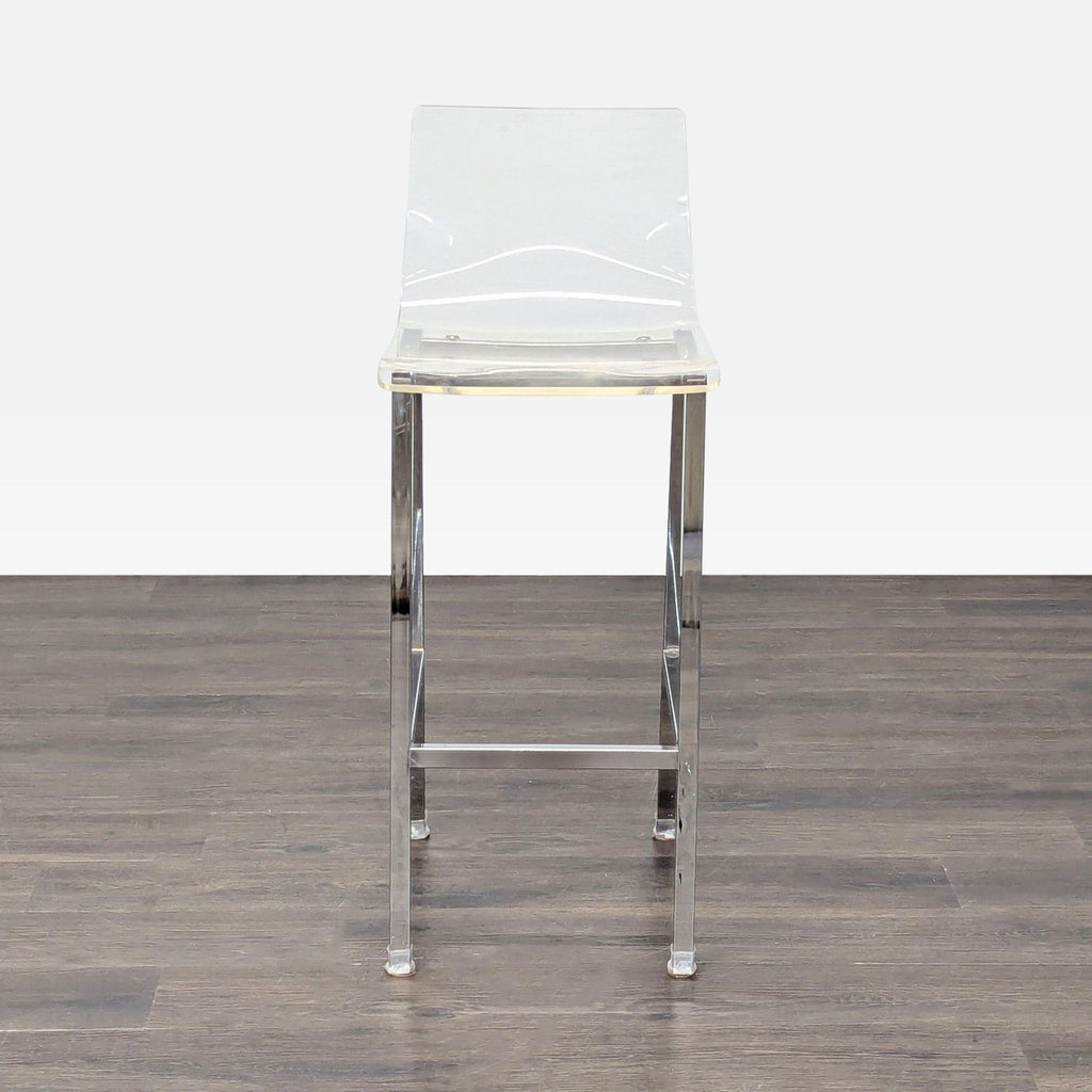 1. Modern clear acrylic bar stool with chrome legs, viewed from the front, on a wooden floor.