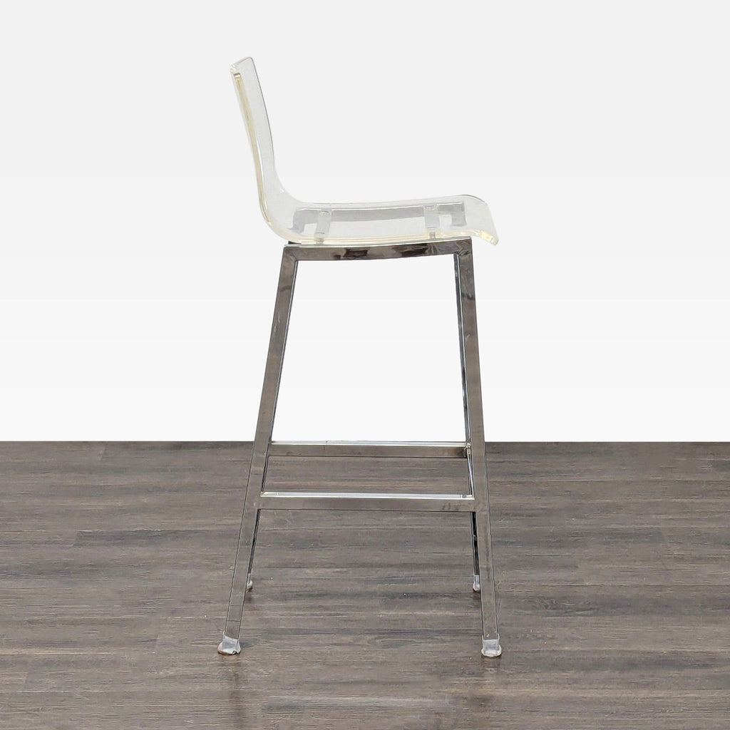 3. Sleek bar stool with a clear seat and chrome legs, side profile, suitable for modern interiors.