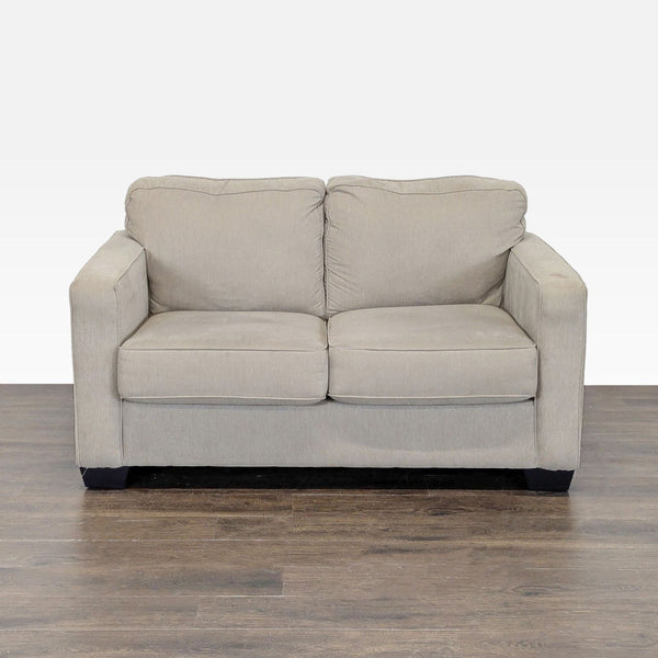 1. Ashley Furniture beige loveseat with soft fabric and modern design, featuring cushioned seat and back.