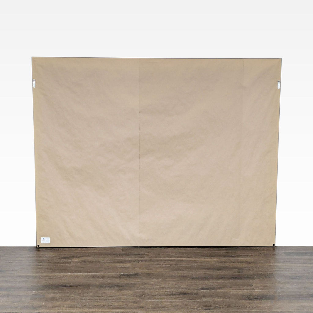 3. Back view of a professionally framed artwork with paper backing and hanging hardware, category: Drawings & Paintings.