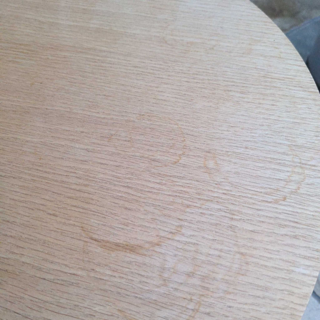 3. Close-up of the end table's wooden surface showing visible circular water stains and wood grain texture.