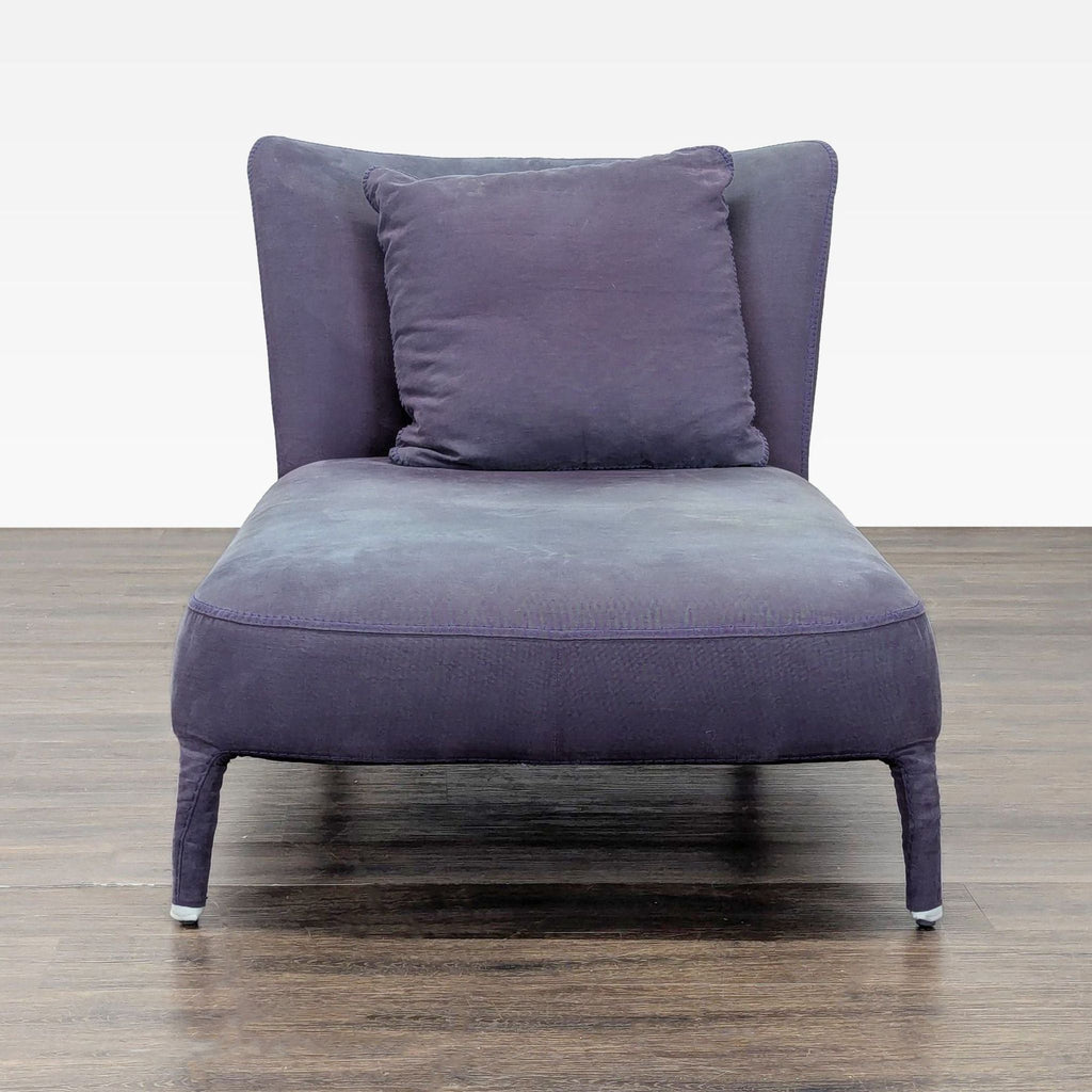 Modern Italian designer lounge chair by Maxalto, featuring a fully upholstered, curved frame and a matching cushion.  
