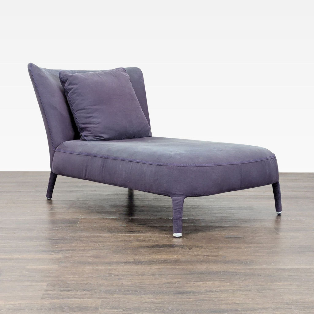 Maxalto Febo chaise lounge with curved back, tailored stitching, and sculptural upholstered frame, includes back cushion.  
