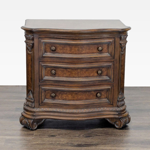 Drexel Heritage end table featuring walnut and burl veneers, serpentine top, and three drawers with brass knobs.  