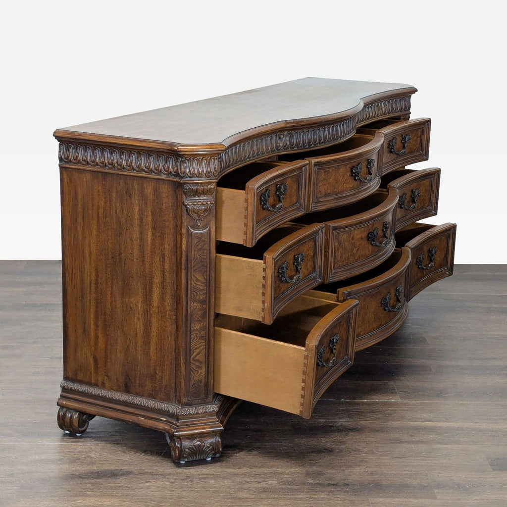 Side view of Drexel Heritage dresser showing ornate details and spacious, partially open drawers.  