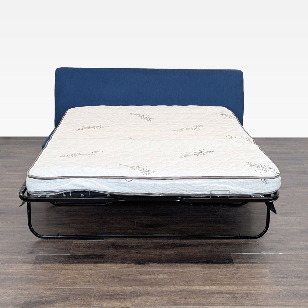 2. Viesso sleeper sofa extended, showing its pull-out bed with mattress for versatile seating and sleeping needs.