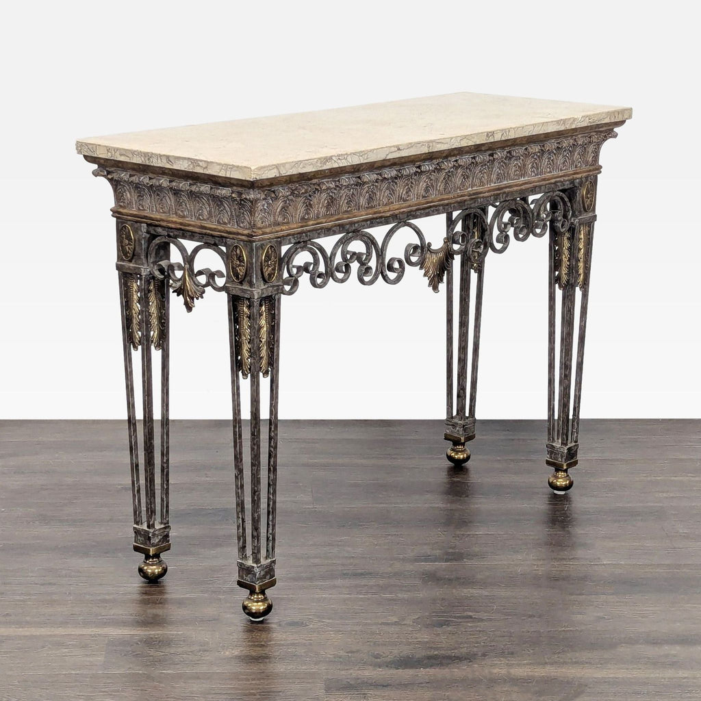 Angled view of Maitland-Smith side table, showcasing marble top, iron base, and elegant brass embellishments.