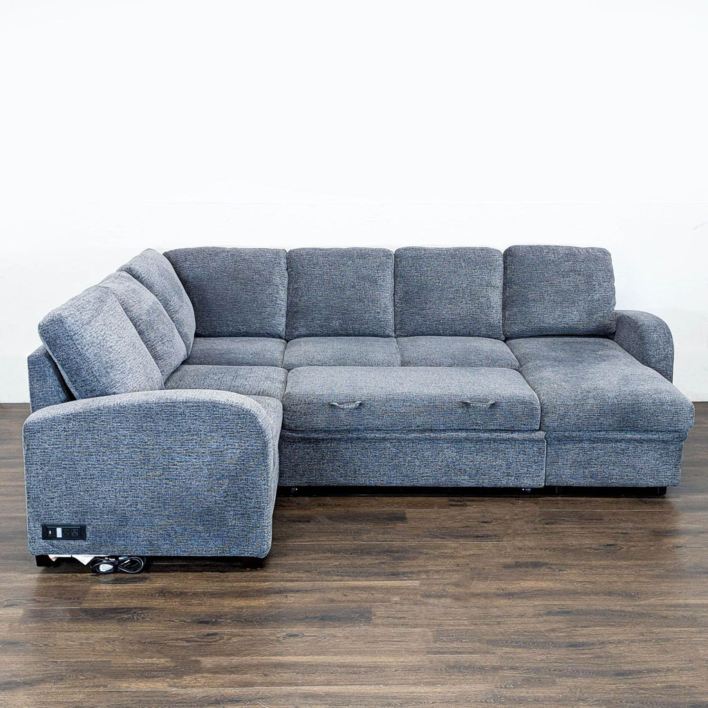 Lifestyle Solutions sectional in gray, with soft cushions, hidden storage, and a convenient charging outlet built in.