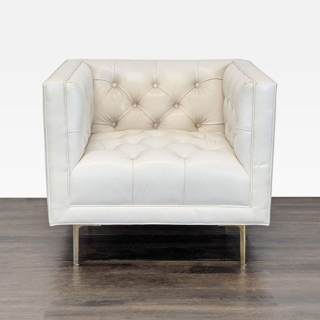 Front view of the Elite Leather Company Mila lounge chair in Grotto ivory leather with deep tufting and metal base.
