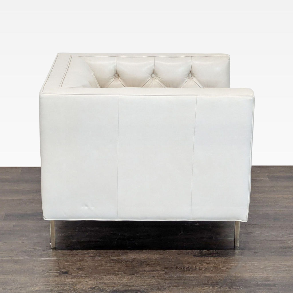 Back view of the Mila lounge chair, highlighting its clean lines and elegant Grotto ivory leather finish by Elite Leather.
