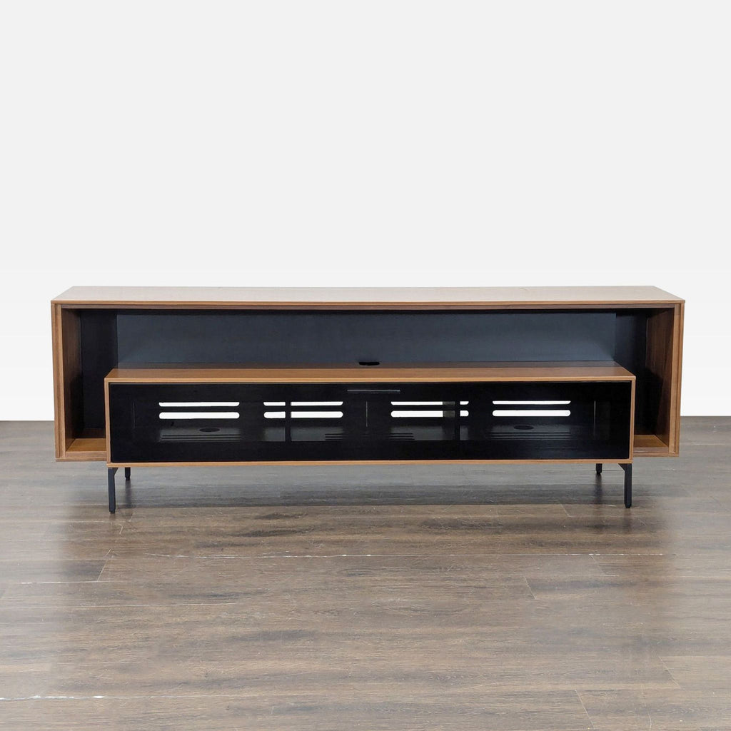 1. Modern BDI entertainment console with walnut wood, open shelf, black glass drop-down door, and cable cutouts.