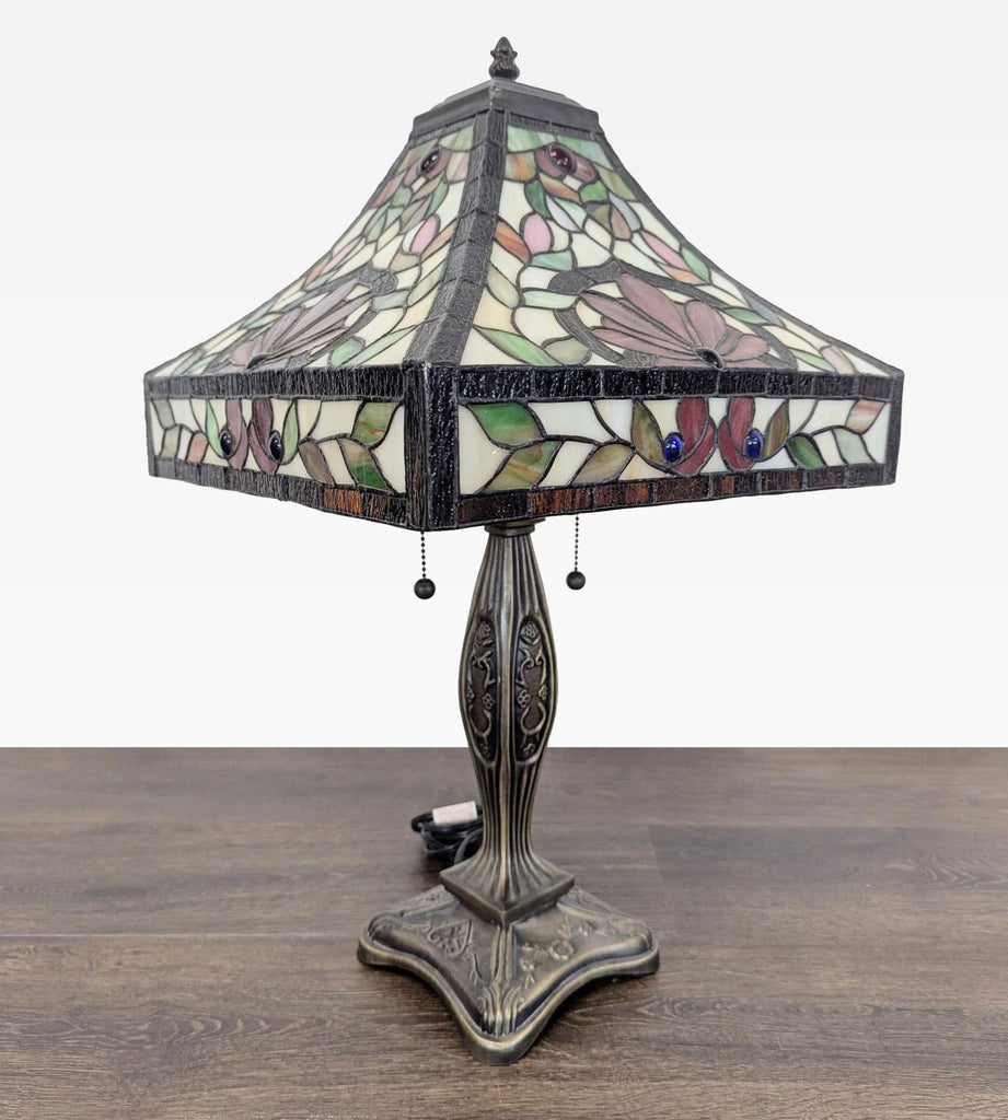 Elegant table lamp in Lighting, featuring a vibrant floral stained glass shade and pull chain switches.