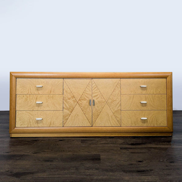 Modern Calligaris dresser with six drawers and a central cabinet in a light wood finish, ideal for storage.