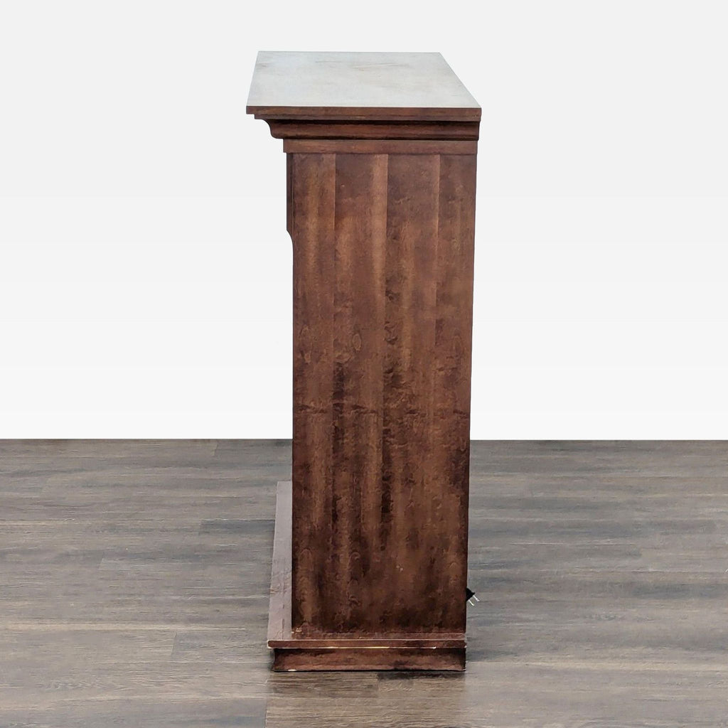 Electric fireplace by Dimplex with elegant wood mantel, ideal for stylish heating in living rooms or bedrooms.