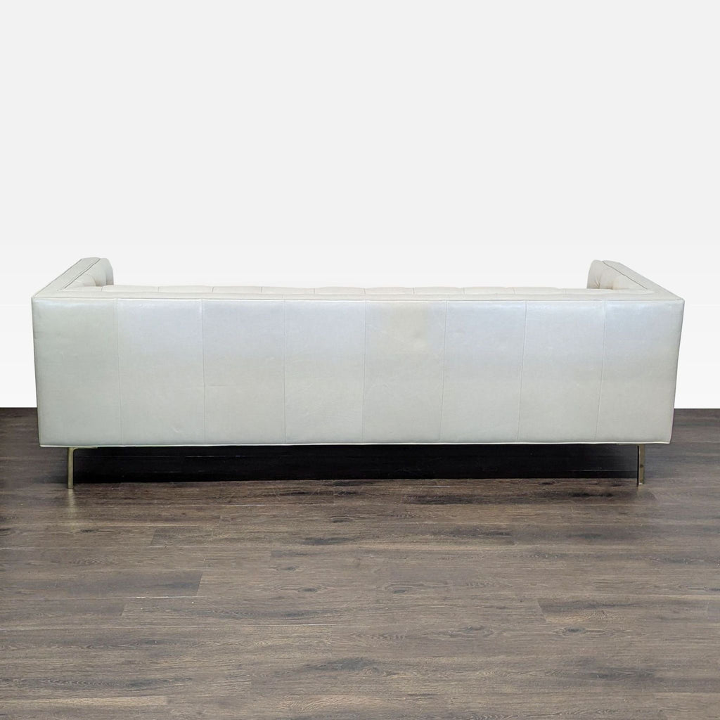 Elite Leather Company 3-seat sofa with soft tufted leather, high square arms, and minimalist metal legs.